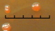 <b>Fig. 3.</b> Kolonier av <i>Yersinia pestis</i>, stam Bombay 1 (som är virulent), odlad på BHI-agar innehållande 0.05% kongorött och 1% galaktos. Agarplattan har inkuberats vid 20°C under 2 dygn. Kolonier av virulenta stammar, som har <i>pgm</i>-lokuset för pigmentering, får en rödaktig färgton (jfr. Fig. 1), medan kolonier av icke-virulenta stammar är vita (jfr. Fig. 2). Figuren är en delförstoring av Fig. 1. och pilen visar på en koloni, där bakterierna har genomgått en spontan deletionsmutation i <i>pgm</i>-lokuset och därför blir gråvita. Längden av hela skalstrecket motsvarar 5 mm. <p>
